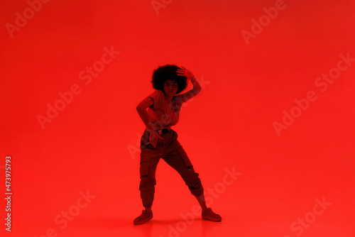 Young black attractive woman dancing hip hop dance © Svitlana