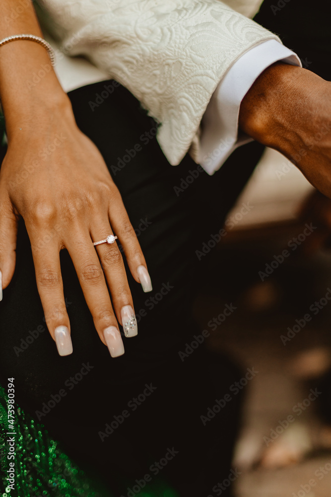 Obraz premium bride and groom holding hands