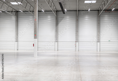 Clean and empty industrial hall in detail for supporting poles
