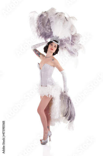 Burlesque dancer performing burlesque show with stage costume, isolated on white photo