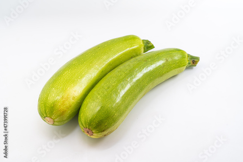 Fresh zucchini on pure white background