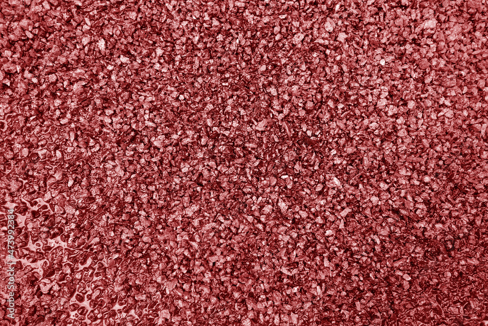 Fototapeta premium Asphalt road closeup in red tone.