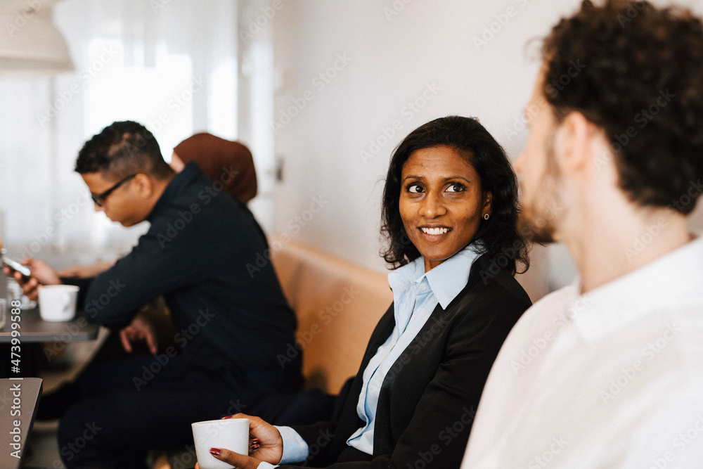 Coworkers talking to each other Coworkers talking to each other