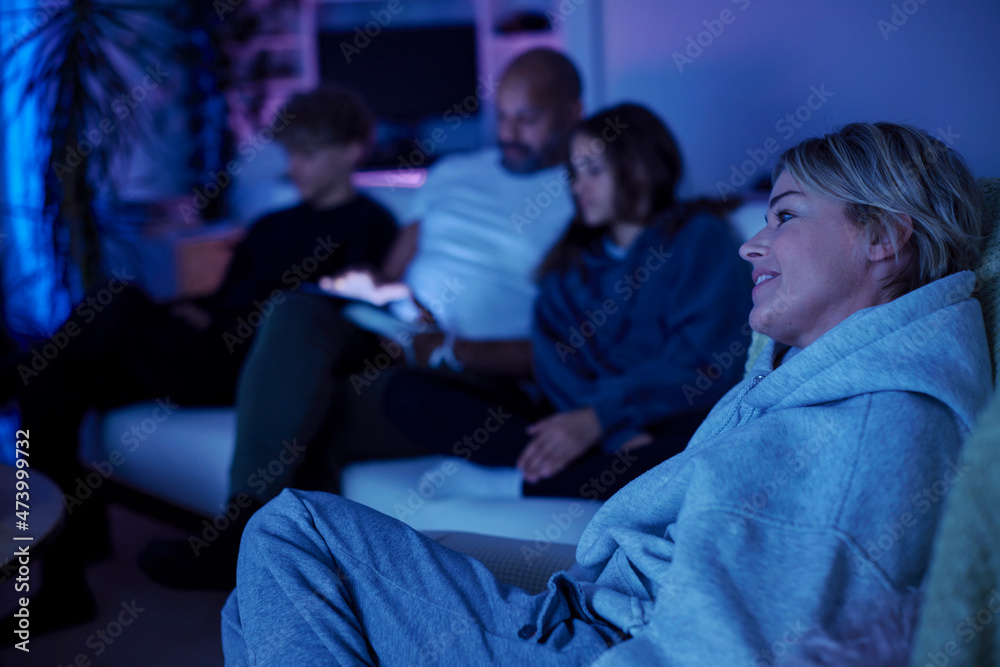 Family with teenage children sitting on sofa Family with teenage children sitting on sofa