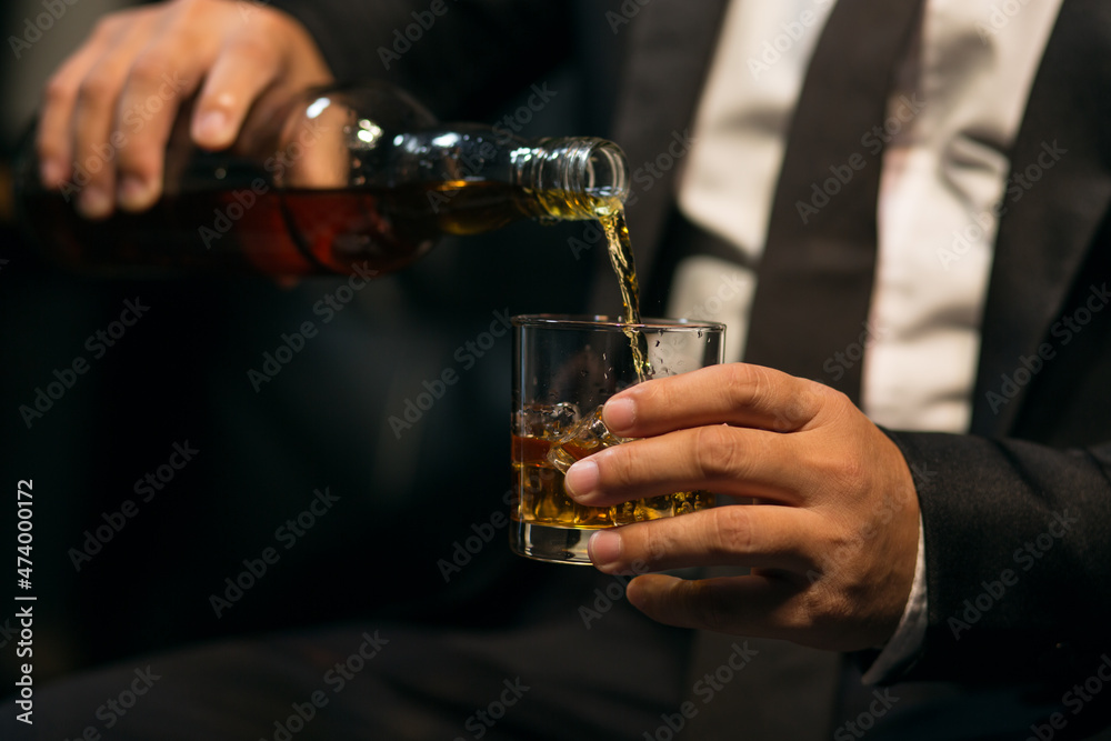 Businessmen in suits drinking whiskey Businessmen in suits drinking whiskey