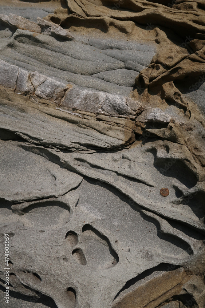 texture of porous stones on the beach, nature, natural phenomena, brown-gray stones texture of porous stones on the beach, nature, natural phenomena, brown-gray stones