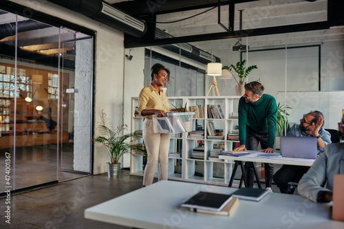 Businesswoman with belongings coming back in office