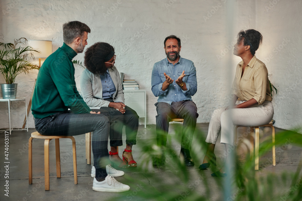 Fototapeta premium Man talking to the mental health support group