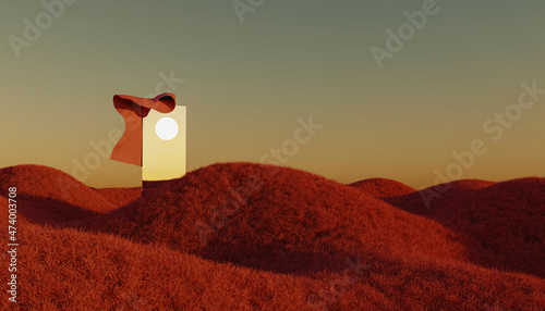 Setting sun reflecting in mirror standing amid brown grassy hills