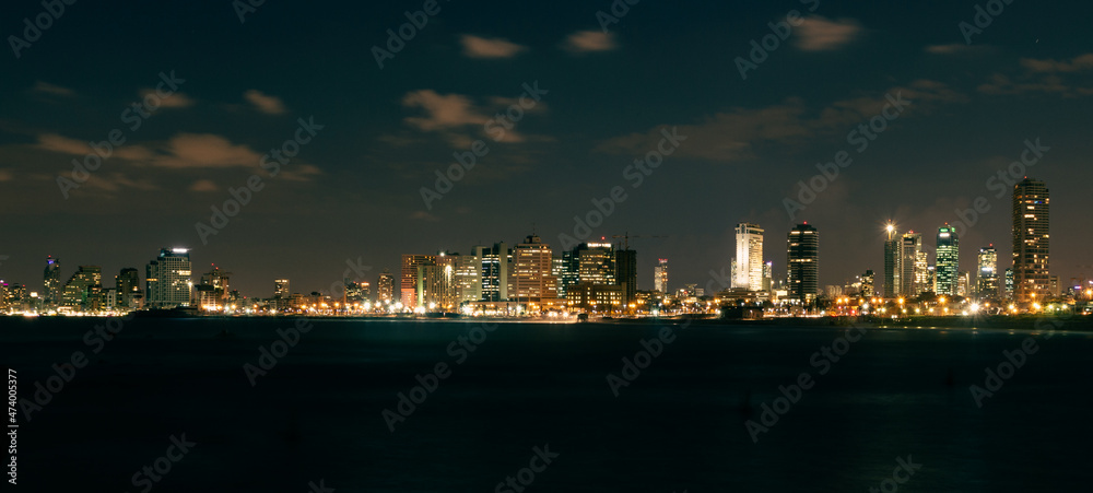 Tel Aviv city in Israel at night . Long exposure shot taken in 2013 from the sea side.