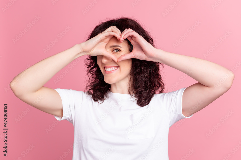 Photo of young pretty girl show fingres heart figure look valentine day isolated over pink color background