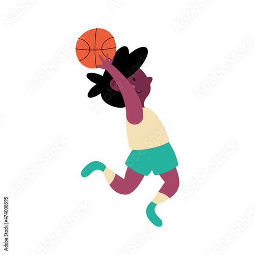 afro boy practicing basketball