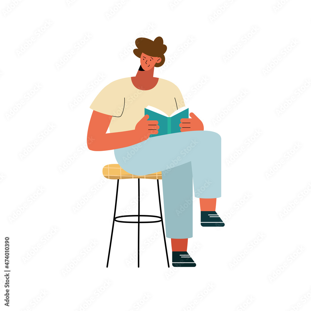 man seated reading book