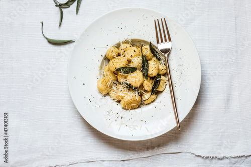 Plate of ready-to-eat Italian gnocchi dumplings with grated Parmesan cheese