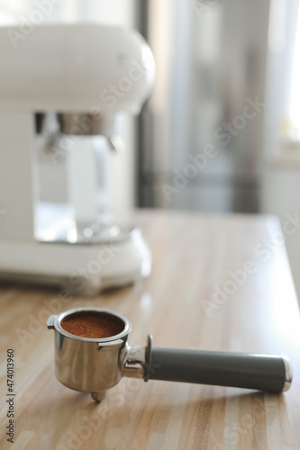 white stylish coffee machine in cozy kitchen interior