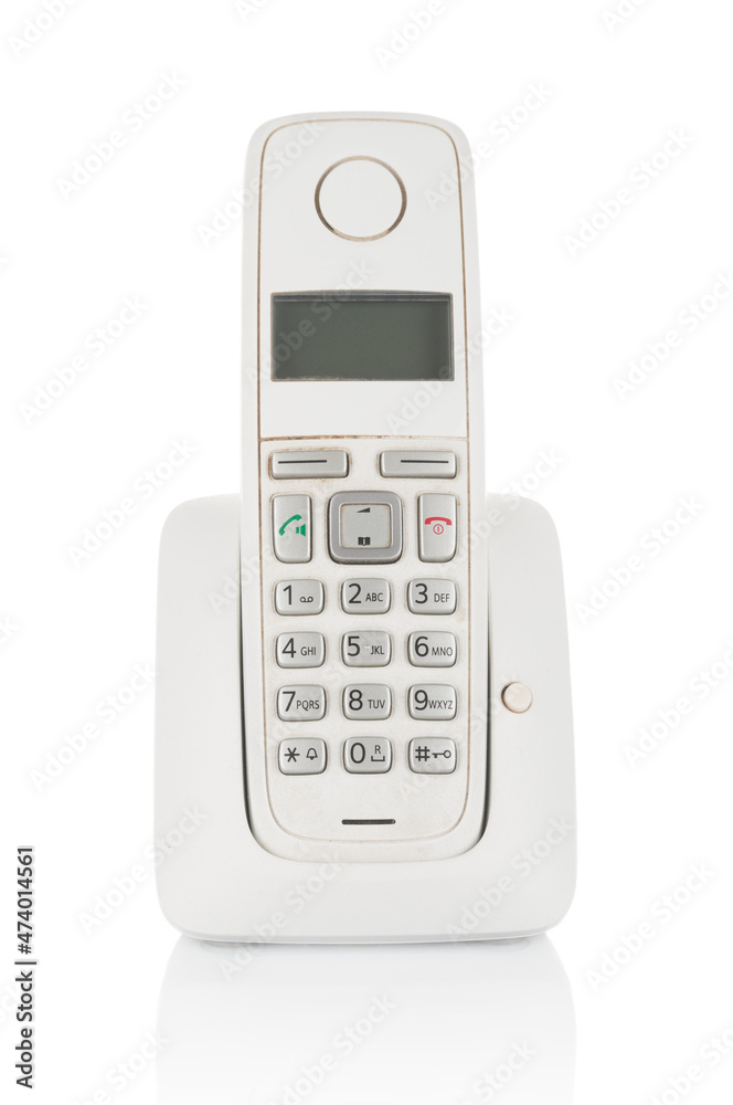 Old-fashioned used wireless phone isolated on white background Old-fashioned used wireless phone isolated on white background