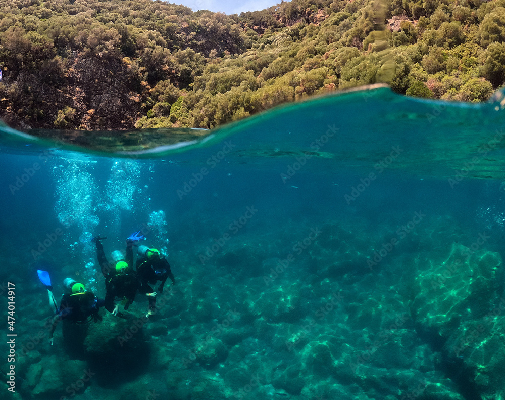 Tourists scuba dive Mediterranian Sea. Turkey.