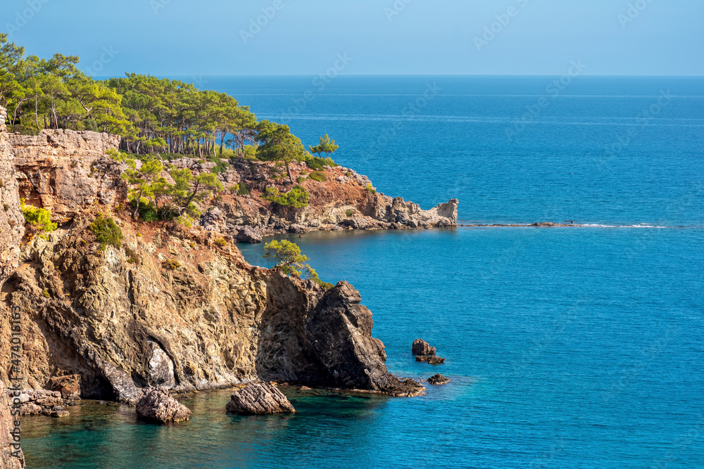 Mediterranean seascape with steep wooded coast