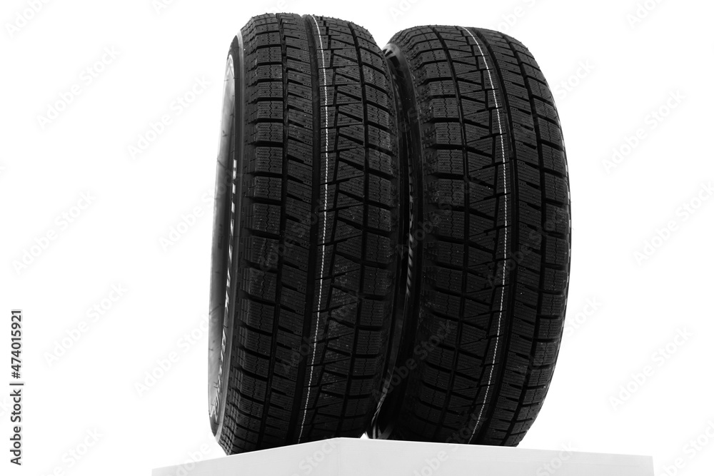 winter tires on a white wall background