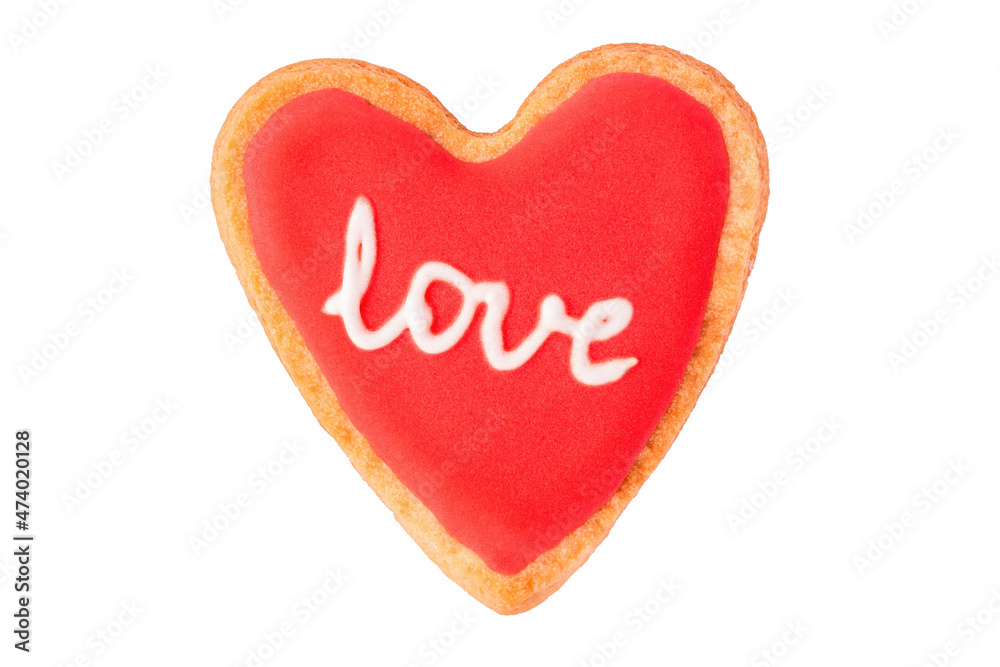 Homemade heart shaped cookie with red icing and lettering LOVE isolated on white background Homemade heart shaped cookie with red icing and lettering LOVE isolated on white background