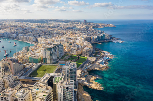 Malta, Central Region, Sliema, Aerial view of soccer field, apartments and hotels of Tigne Point peninsula photo