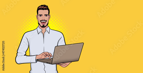 Smiling bearded businessman with laptop