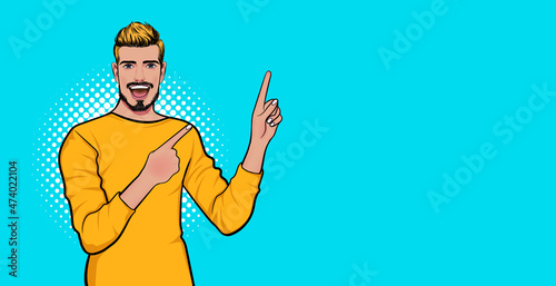 surprised smile man point finger at empty space
