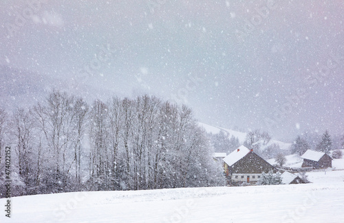 Countryside farms during heavy snowfall