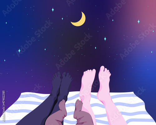 Family sleeping under the night sky
