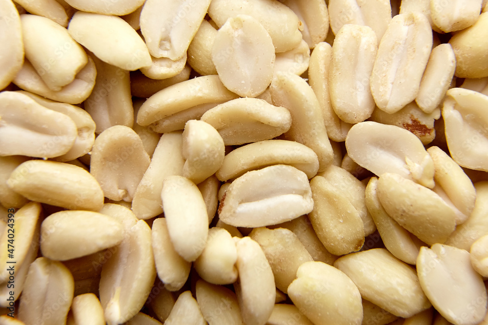 Raw blanched peanuts as food background Raw blanched peanuts as food background