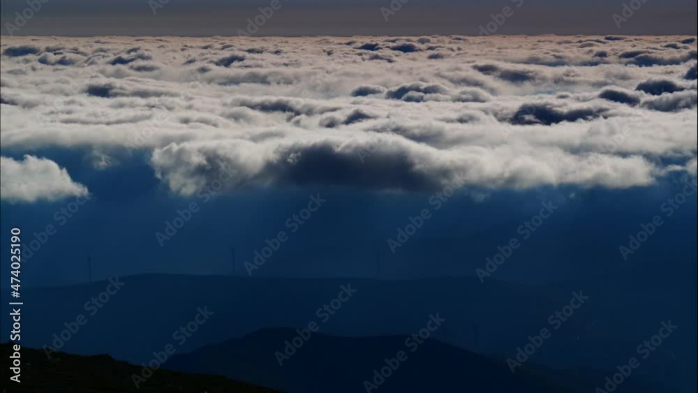 Timelapse of fluffy clouds moving over high mountains. View from Torre mountain peak of Serra da Estrela in Portugal. Timelapse of fluffy clouds moving over high mountains. View from Torre mountain peak of Serra da Estrela in Portugal.