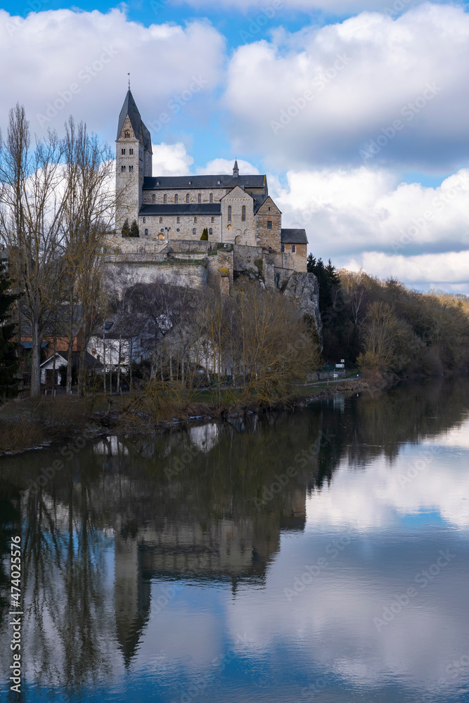 Reflection of the Basilica of Dietkirchen / Germany in the Lahn on a sunny spring day Reflection of the Basilica of Dietkirchen / Germany in the Lahn on a sunny spring day