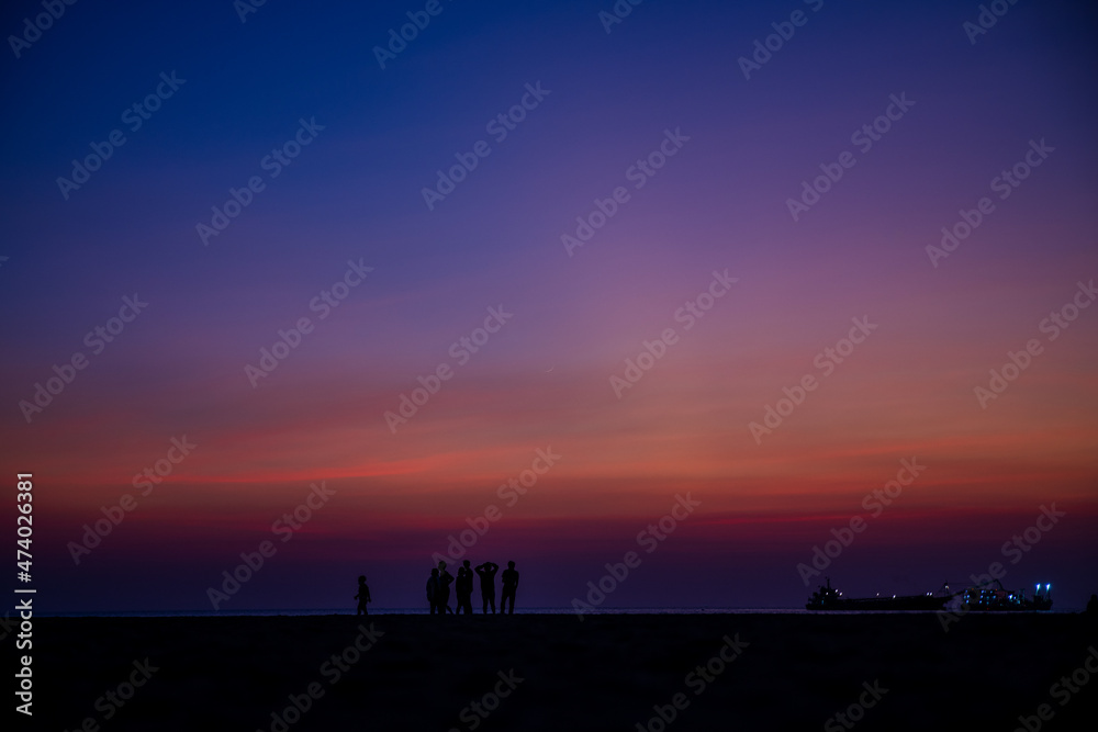 Twilight and crescent moon by the sea in Pattaya Bay