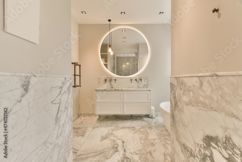 Interior of spacious bathroom with sink and cabinet photo