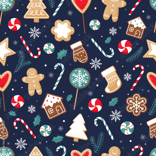 Seamless Christmas pattern with gingerbread cookies and sweets.