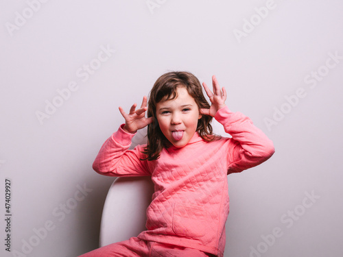 Funny little girl making face