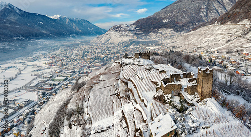 Castel Grumello and vineyards, near Sondrio in Valtellina, winter aerial view	 photo