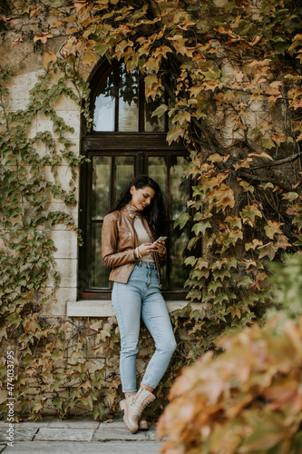 Young woman with mobile pho...