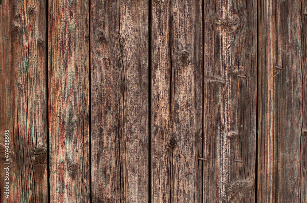 Naklejka premium wooden burnt old boards with bent nails solid background