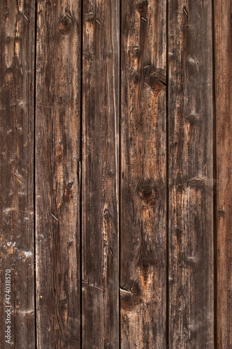 wooden burnt old boards with a solid background in a vertical format