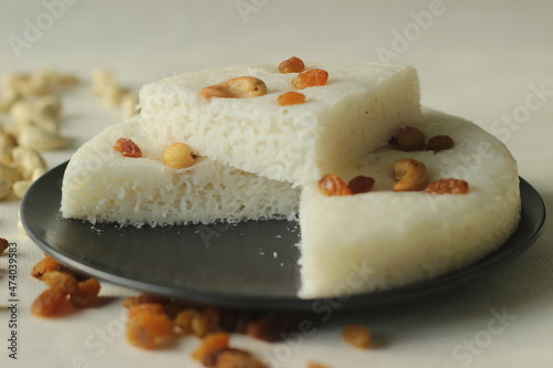 Vattayappam. Steamed rice cake made of sweet fermented batter of rice and coconut, topped with raisins while steaming. Traditional snack from south kerala