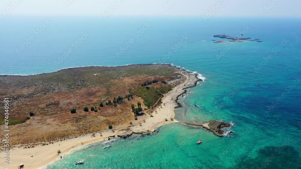 Aerial Panning Beautiful Shot Of Palms Island, Drone Flying Backwards Over Turquoise Sea - Tripoli, Lebanon Aerial Panning Beautiful Shot Of Palms Island, Drone Flying Backwards Over Turquoise Sea - Tripoli, Lebanon