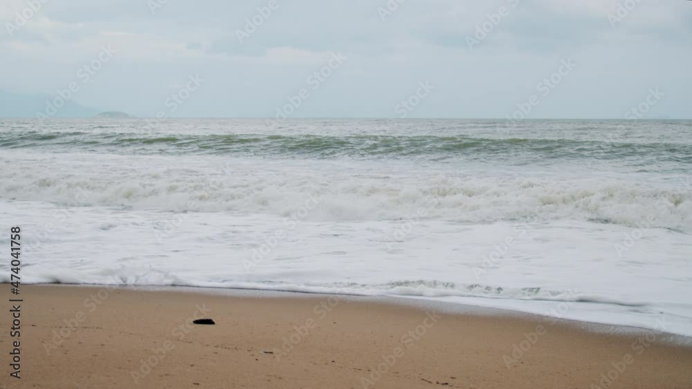 Swirling ocean waves, bad weather, tide waves to the coast. The force of the waves breaking the spray of sea foam.Slow motion Swirling ocean waves, bad weather, tide waves to the coast. The force of the waves breaking the spray of sea foam.Slow motion