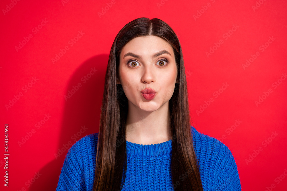 Photo portrait brunette sending air kiss on date isolated on vibrant red color background Photo portrait brunette sending air kiss on date isolated on vibrant red color background