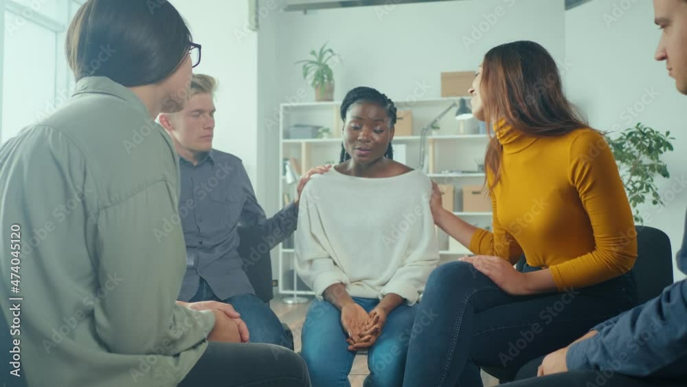 African American Woman Shares Her Personal Addiction Problem, Emotional Pain, Receives Psychological Support, Compassion, Empathy From People in a Group Therapy Session. Abuse, Violence, Depression. African American Woman Shares Her Personal Addiction Problem, Emotional Pain, Receives Psychological Support, Compassion, Empathy From People in a Group Therapy Session. Abuse, Violence, Depression.