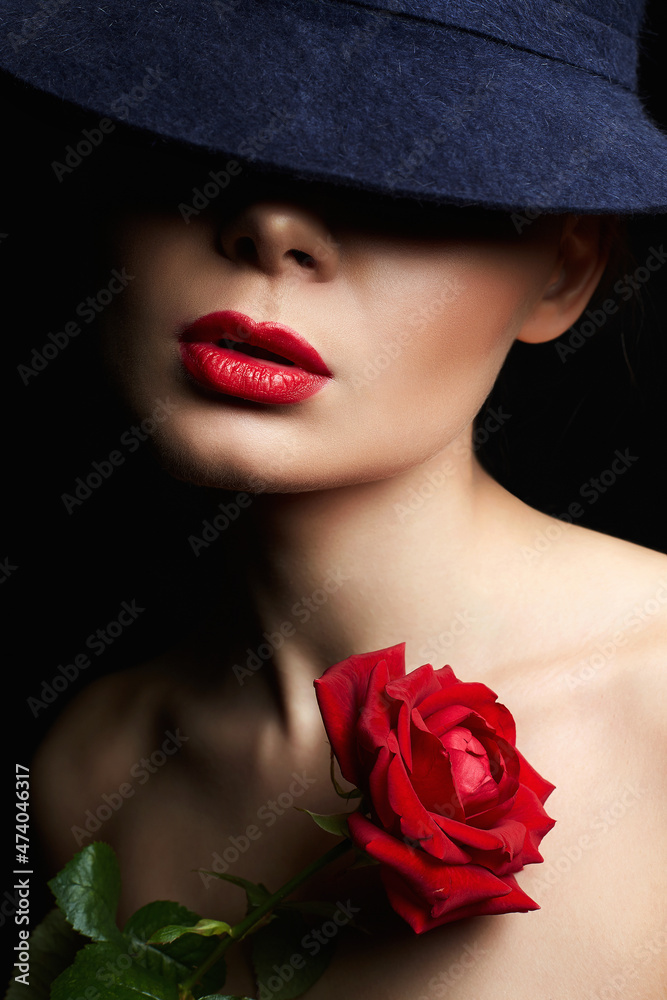 Naklejka premium Beautiful young Woman In Hat and Flower. Lovely girl with make-up and Red Rose