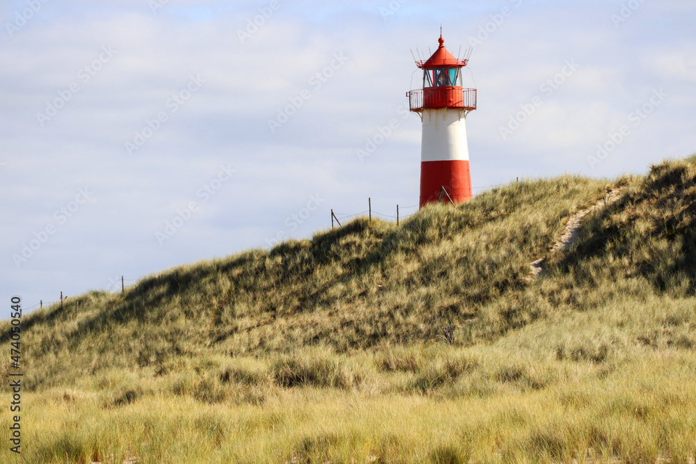 Red and White lighthouse in Sylt Germany Red and White lighthouse in Sylt Germany