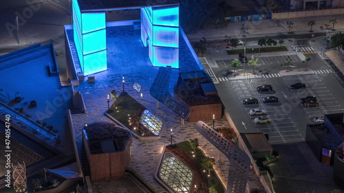 New promenade on gate avenue located in Dubai international financial center aerial night timelapse.