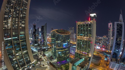 Dubai international financial center skyscrapers aerial all night panoramic timelapse.