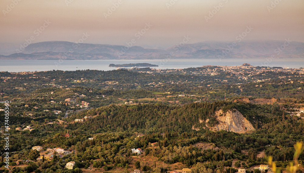 Sunset view over eastern coast of Corfu , Greece.